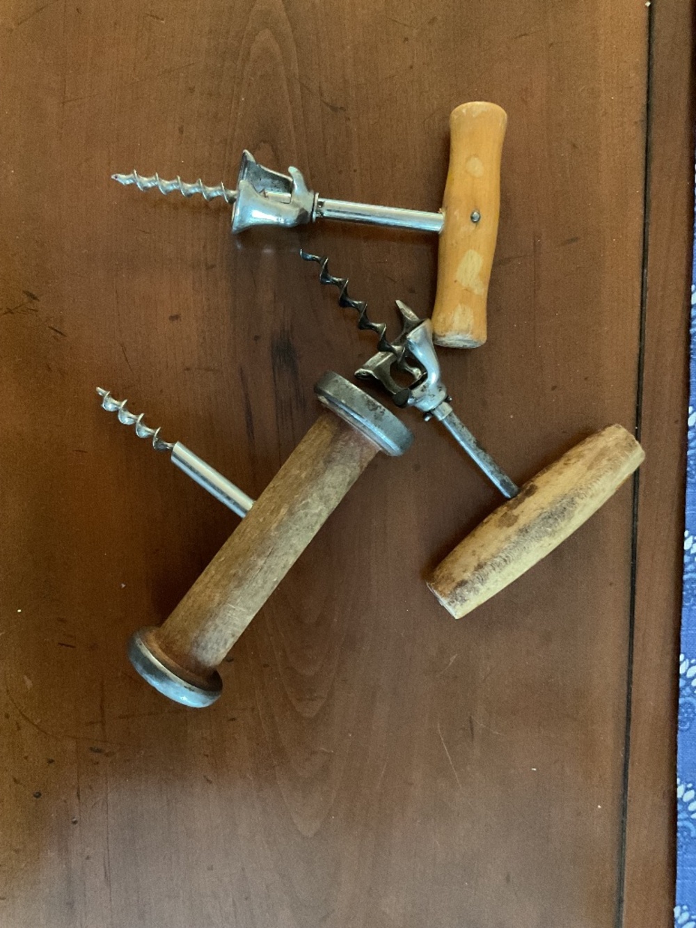 Three antique wine openers- sold as a set